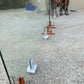 Turn knobs on GlassMate tool to easily adjust each panel of glass to ensure they are level, plumb and perfectly aligned with other panels before setting spigots into concrete